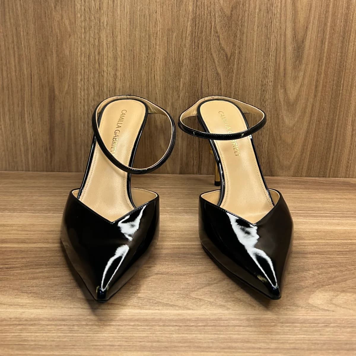 Emma mule shoes in black patent leather with a gold -tone sphere heel