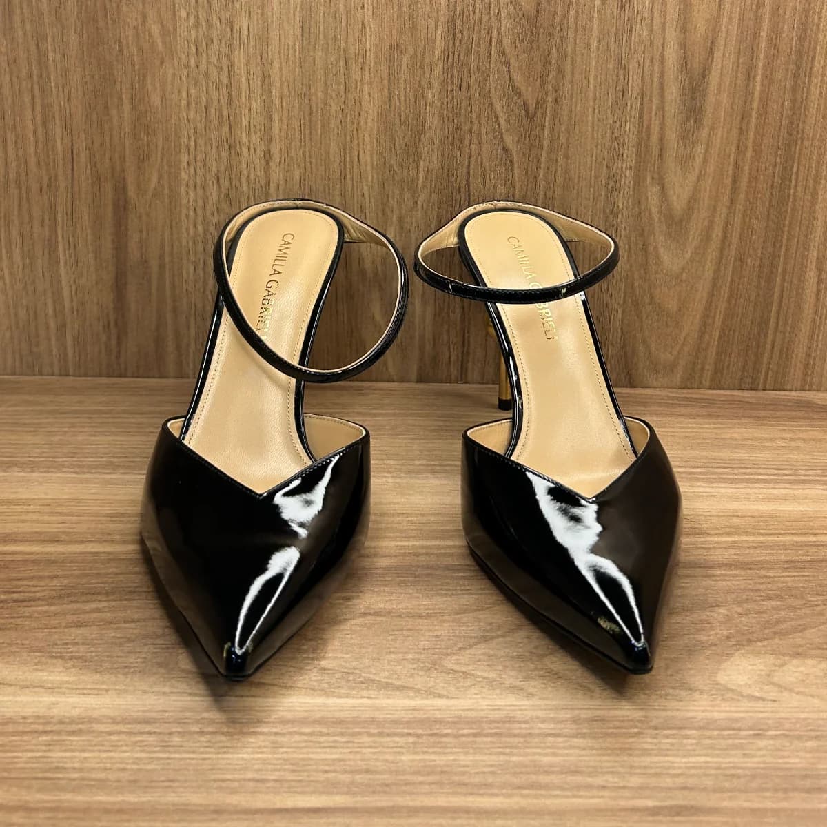 Emma mule shoes in black patent leather with a gold -tone sphere heel